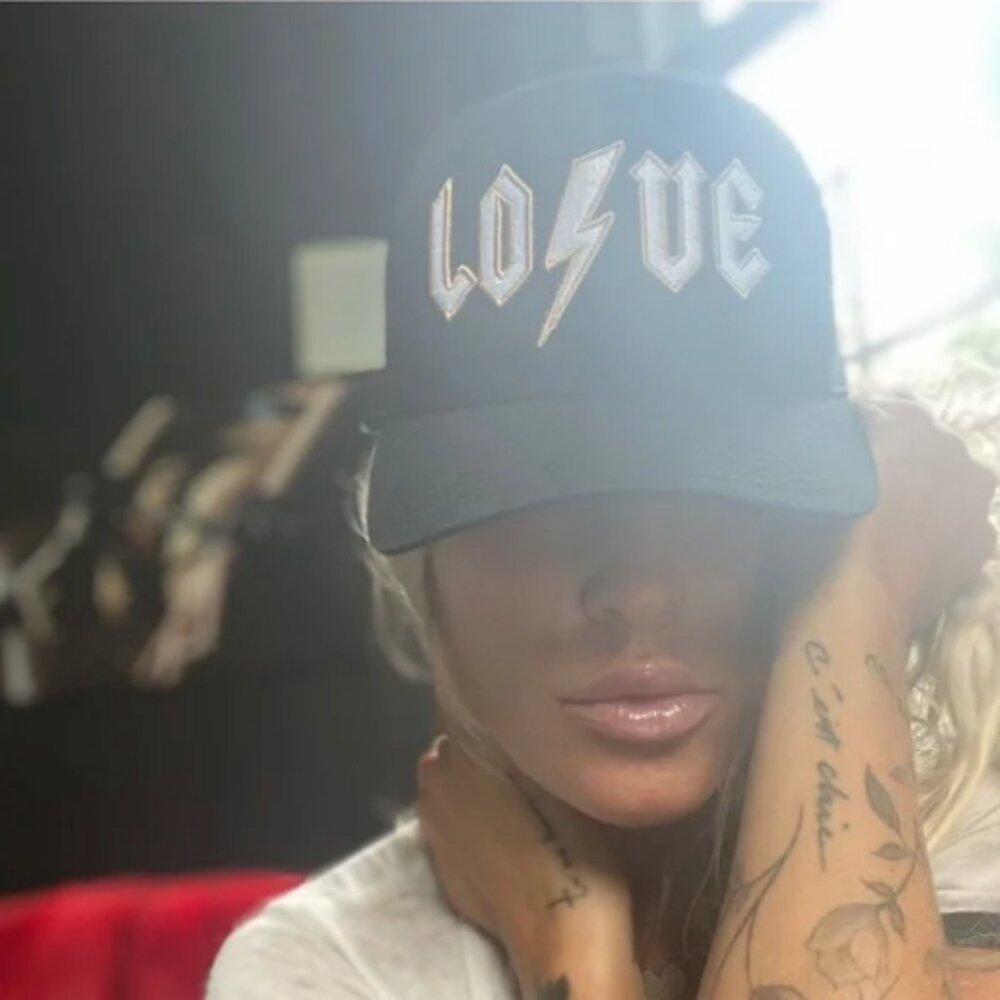 The LOVE trucker hat in black OS